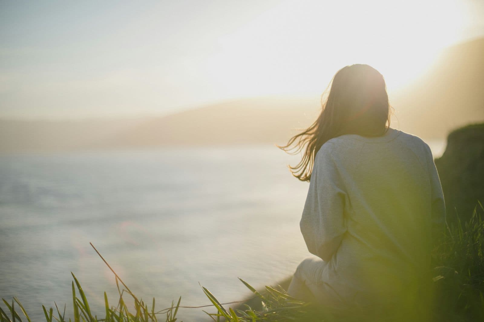 Person on a video call in a calm, sunlit space