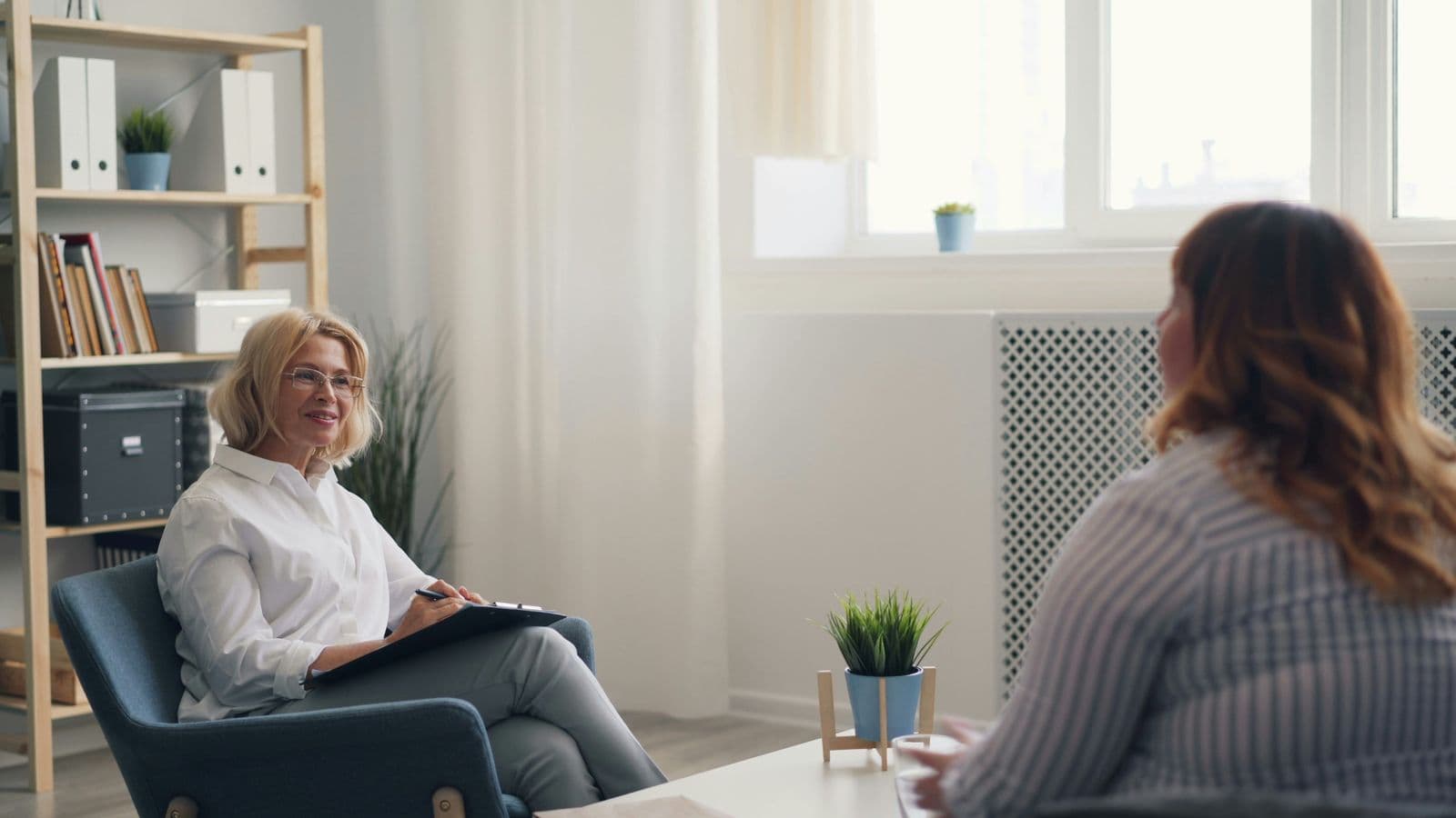 Experienced therapist in a warm, supportive session